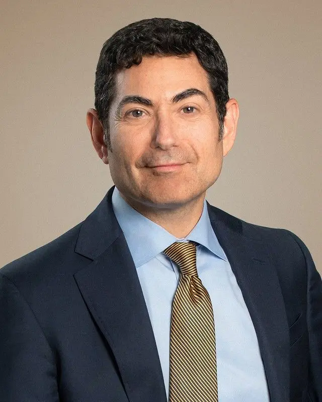 Portrait of Mariano-Florentino (Tino) Cuéllar, Chief Global Affairs Officer at Anthropic